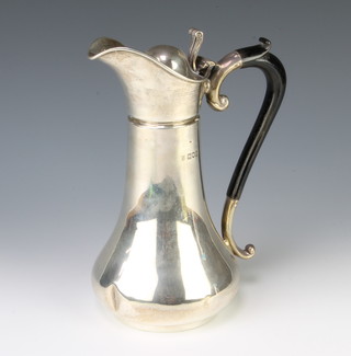 An Edwardian silver water jug with ebony handle London 1905, gross 447 grams, 22cm 