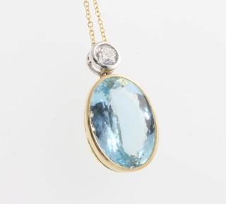 An aquamarine and diamond oval pendant the main stone 8ct supported by a brilliant cut diamond approx 0.4ct 