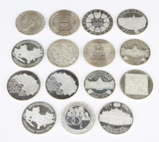 Twelve 100 shilling silver coins and three 50 mark coins 352 grams 