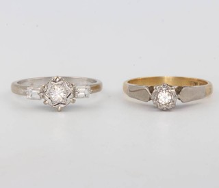 An 18ct white gold single stone diamond ring and a yellow gold do. size K and K 1/2 