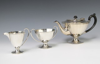 An Art Deco 3 piece silver plated pedestal tea set with ebonised mounts 