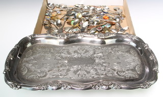 A quantity of Continental souvenir spoons and a plated tray