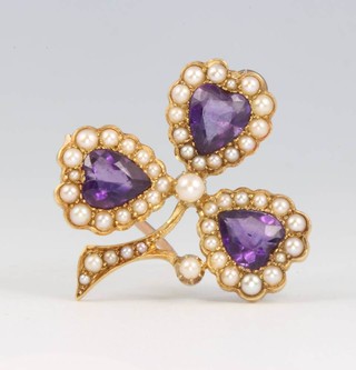An Edwardian 15ct yellow gold amethyst and seed pearl clover brooch 30mm x 30mm 