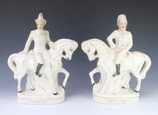 A pair of Staffordshire flat back figures - Wolseley and Gordon, with gilt decoration  38cm 