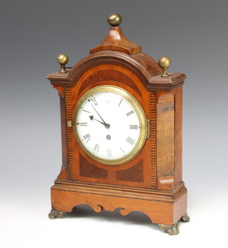 A Sedan style timepiece with enamelled dial and Roman numerals contained in an arched shaped inlaid mahogany case 