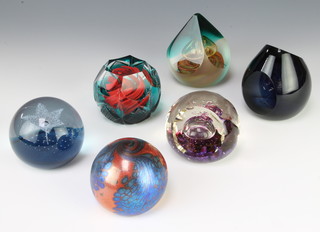 Four Caithness paperweights Solstace 39/350 9cm,  Ice Princess 38/500 9cm, Endearment 22/75 6cm and Star Flowers 549/1000 8cm, a Studio paperweight 7cm and a Selkirk Talisman 177/500 7cm 

