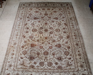 A white and floral ground Kashan carpet 390cm x 275cm, 
