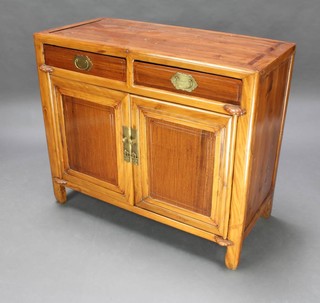 A Chinese light padauk cabinet fitted 2 drawers above double cupboard 68cm h x 114cm w x 47cm d 