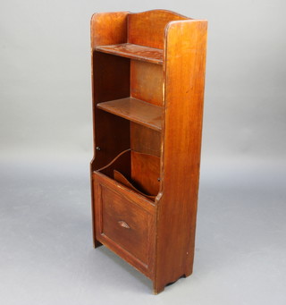 A 1930's oak bookcase Canterbury, the arched top fitted 2 shelves, Canterbury base with fall front 105cm x 44cm x 19cm 