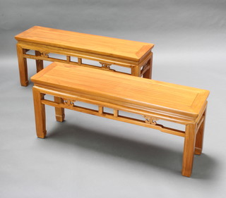 A pair of rectangular Chinese light Padauk benches/stools raised on square tapered supports with pierced apron 48cm h x 115cm w x 31cm d 