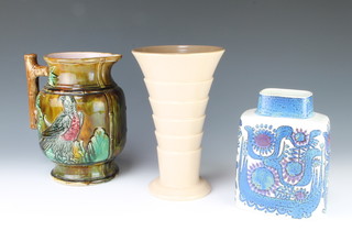 A 1970's Royal Copenhagen flattened baluster vase with geometric decoration 20cm, a Poole cream glazed sectional vase 25cm and a Victorian Majolica jug 24cm 