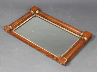 A 19th Century rectangular plate mirror contained in a rosewood and gilt frame with columns to the sides 47cm x 78cm 