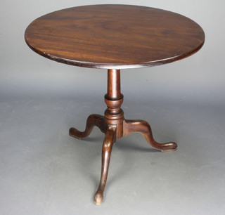 A circular George III mahogany snap top tea table, raised on a turned column and tripod base 60cm h x 75cm diam. 