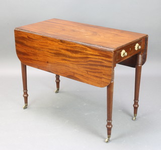 A Regency mahogany Pembroke table fitted a drawer raised on ring turned supports, brass caps and casters 69cm h x 90cm x 47cm