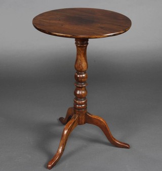 A Victorian circular rosewood snap top wine table raised on turned column and tripod base 67cm x 45cm