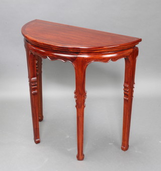 A Chinese Padauk demi-lune hall table raised on square tapered supports 78cm h x 82cm w x 41cm d 