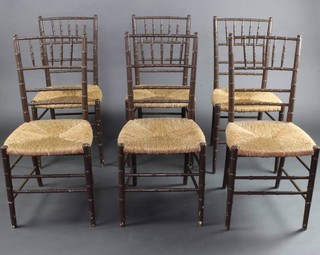 A set of 6 grey painted faux bamboo rout chairs with woven rush seats 