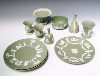 A Wedgwood green Jasper tazza with vinous decoration 10cm, a pair of do. urns, a bell, 2 vases, a bowl and 3 plates 