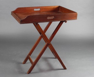 Army & Navy Stores, an Edwardian rectangular mahogany butler's tray raised on a folding stand 84cm x 76cm x 50cm 
