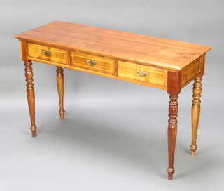 A Victorian stye rectangular mahogany side table fitted 3 long drawers raised on turned supports 75cm h x 120cm w x 45cm d 