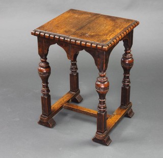 A Victorian rectangular carved oak stool with dentil top, raised on turned cup and cover supports with H framed stretcher 55cm x 41cm x 37cm 