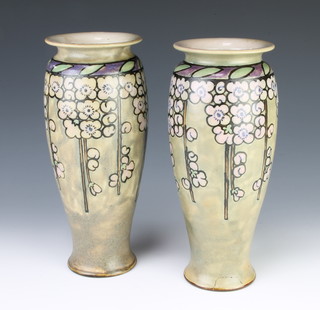 A pair of Royal Dolton oviform vases decorated with stylised flowers 27cm 