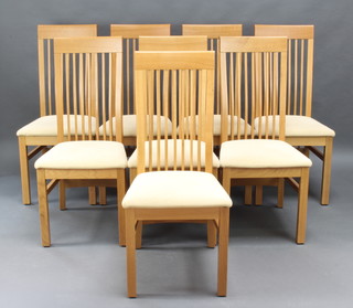 A set of 8 oak framed Shaker style stick and rail back dining chairs 
