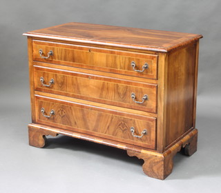 A Queen Anne stye figured walnut chest with quarter veneered and crossbanded top fitted 3 long drawers, raised on bracket feet 71cm h x 93cm w x 47cm d 