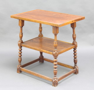 A rectangular walnut 2 tier occasional table raised on turned and block supports with box framed stretcher 75cm h x 49cm w x 30cmd 
