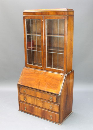 A Queen Anne style figured walnut bureau bookcase 157cm h x 76cm w x 43cm d