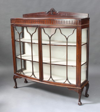 A Chippendale style mahogany bow front display cabinet with raised back, fitted shelves enclosed by astragal glazed panelled doors, raised on cabriole supports 133cm x 121cm x 38cm 