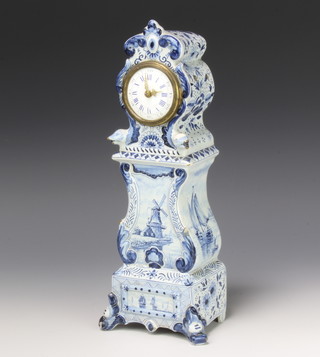A Delft blue and white longcase clock decorated with stylised serpents, windmills, boats and flowers, containing a watch movement with enamelled dial, Roman numerals and numbers 30cm 