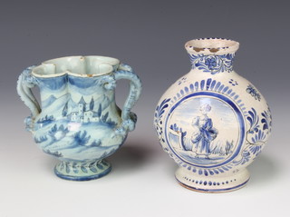 A 19th Century Continental Delft bulbous vase decorated with a panel of a lady and gentleman with scrolling flowers 12cm together with a Continental Delft vase with entwined handles depicting a cherub in a country setting 10cm 
