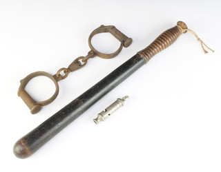 A 19th Century black painted turned Police truncheon 42cm (some damage to handle), a pair of 19th Century steel handcuffs (some corrosion) and a J Hudson & Co. whistle "The Metropolitan" 