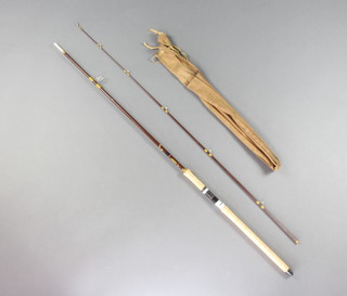 A Hardy Jet 8'6" 7/8lb fibalite spinning fishing rod complete with cloth bag 