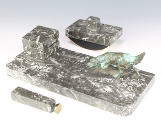 An Art Deco bronze and marble 3 piece desk set comprising an inkwell and pen rest supported by a bronze figure of a standing dog, blotter and seal 