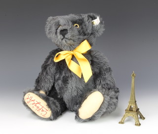 A limited edition Steiff Eifel Tower bear 1998/1999 34cm, complete with certificate and model Eifel Tower, boxed   
