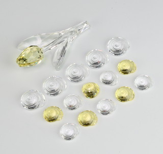 A Swarovski Crystal tulip yellow 657110/9460200004 by Keiko Arai 9cm together with 10 clear and 5 yellow ammonites boxed  