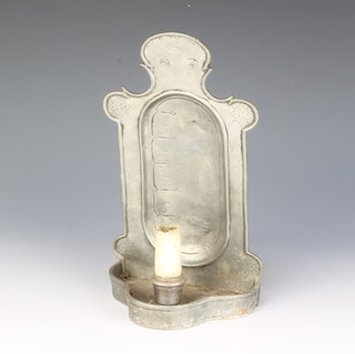 A 17th/18th Century Continental wall mounted candle clock with shaped base 25cm x 15cm x 8cm 