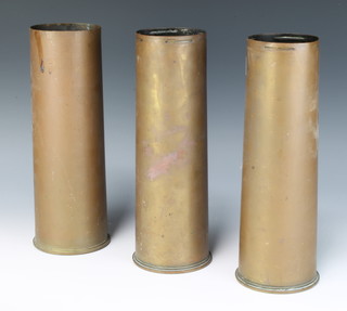 Two Edwardian 18lb brass shell cases dated 1905 together with a 1955 25lb shell case 