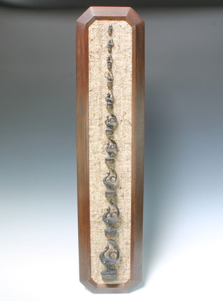 A set of 10 graduated bronze opium weights in the form of birds mounted on a rectangular oak plaque 