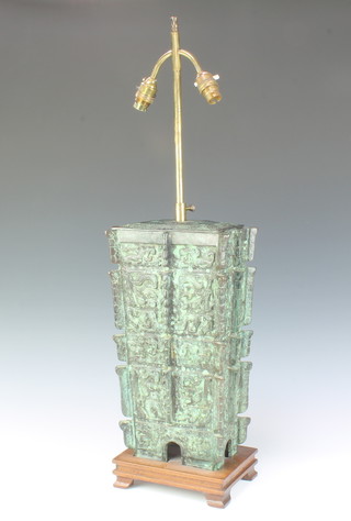 A Chinese bronze table lamp in the form of an archaistic verdigris urn raised on a hardwood stand 45cm h x 22cm w x 15cm d 