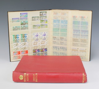 A Windsor album of mint and used GB stamps Victoria to Elizabeth II including penny reds and a stock book of mint GB stamps 
