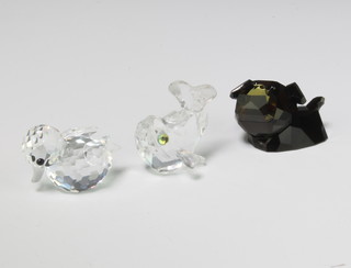 A Swarovski Crystal fish 3cm, do. brown coloured terrier 4cm and a duckling 3cm boxed