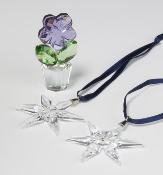 A Swarovski Crystal coloured flower in a pot 5cm, 2 do. Christmas star decorations 4.5cm boxed