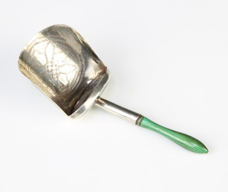A Georgian silver caddy spoon with stained ivory handle and simple engraved decoration 8cm 