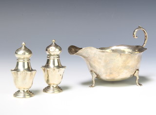 A silver sauce boat Birmingham 1911 and a pair of silver condiments 133 grams 