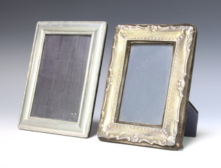 A repousse silver photograph frame London 1988 19cm x 14cm and a plated do. 