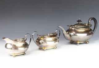 A silver 3 piece tea set of oblong form with ebony mounts on ball feet, Sheffield 1932, maker Atkin Bros gross 1188 grams 