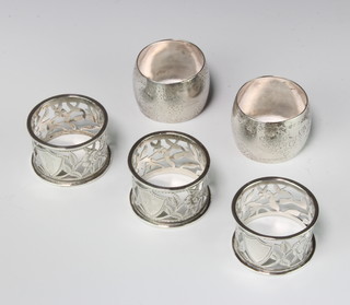 A pair of Victorian silver napkin rings and 3 others, 166 grams